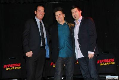 Vegas Hypnotists Anthony Cools and Marc Savard congratulate Kevin Lepine